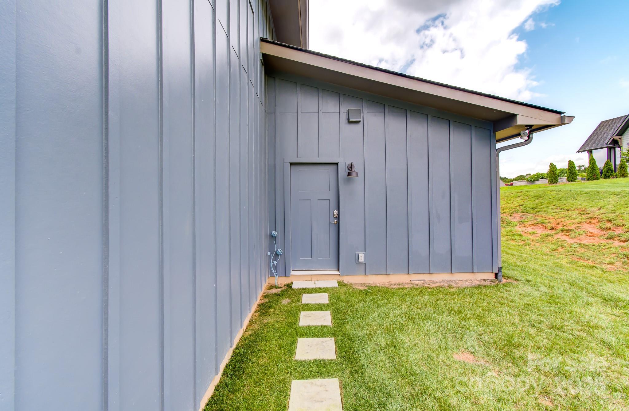 147 Majestic Ridge Road Mills River, NC 28759 - Photo 38 of 48 a view of a backyard with pathway