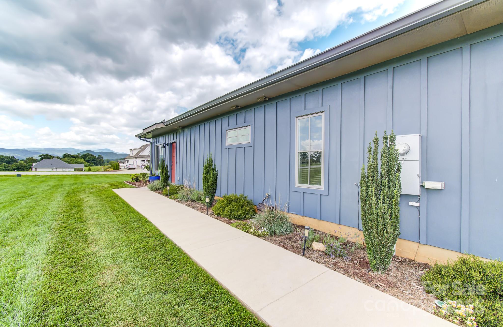 147 Majestic Ridge Road Mills River, NC 28759 - Photo 47 of 48 a front view of a house with garden