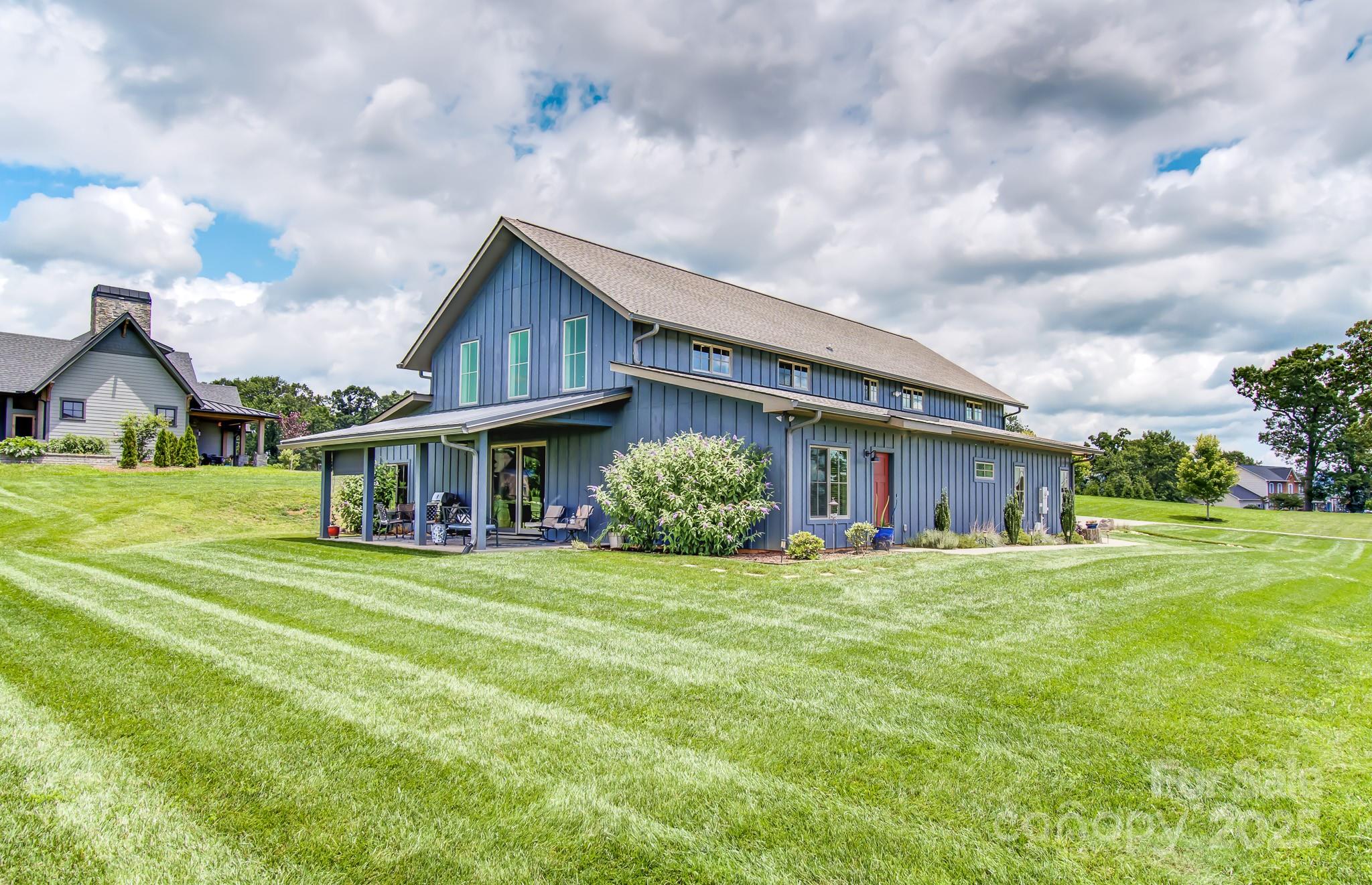 147 Majestic Ridge Road Mills River, NC 28759 - Photo 48 of 48 a view of a house with a big yard and large trees
