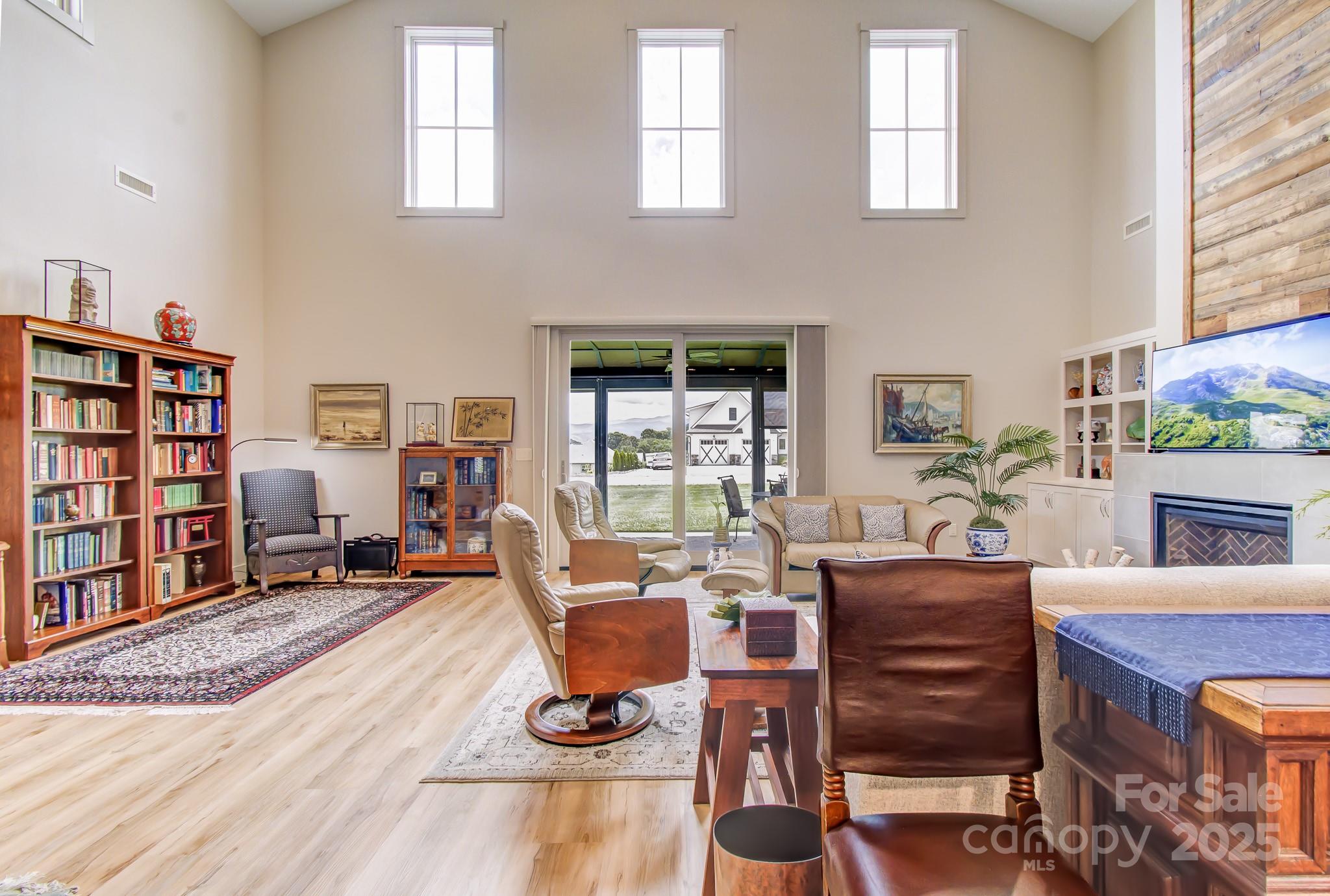 147 Majestic Ridge Road Mills River, NC 28759 - Photo 5 of 48 a living room with furniture and a wooden floor