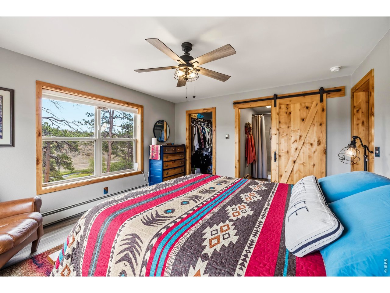 557 Redbluff Road Livermore, CO 80536 - Photo 16 of 50 Primary bedroom- note the custom wood accents
