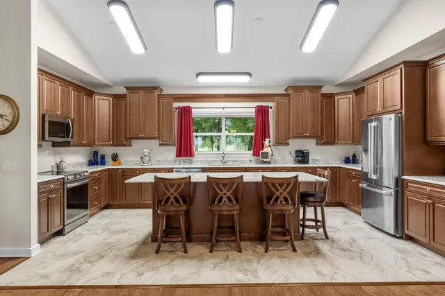 a bedroom with a bed and a television