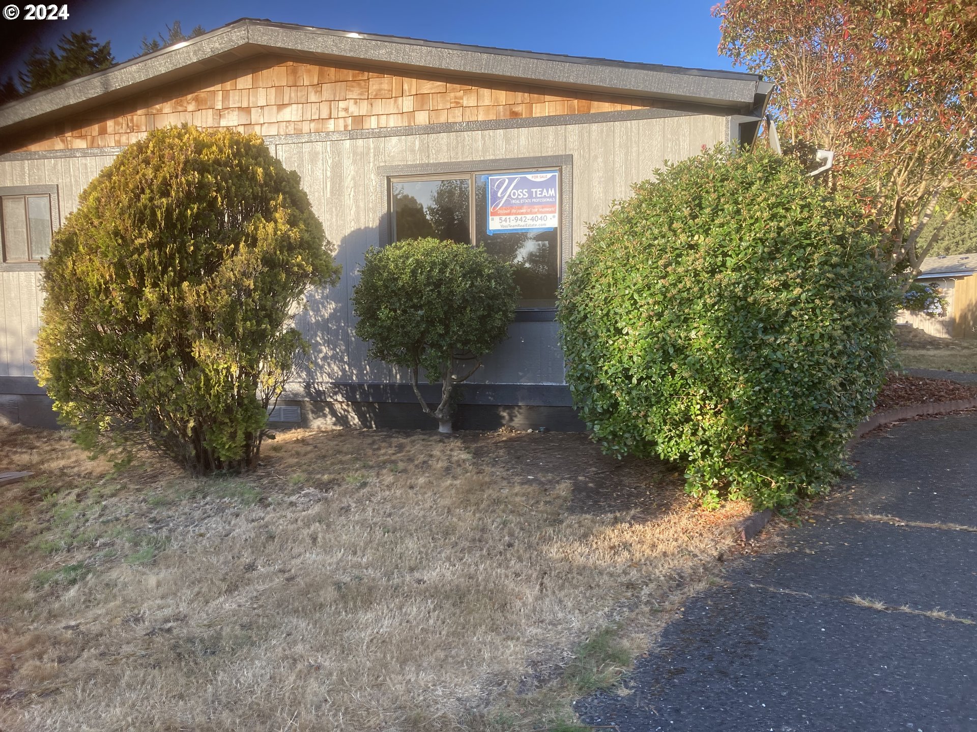100 River Bend Road, Unit 127 Reedsport, OR 97467 - Photo 11 of 21 a view of a garden