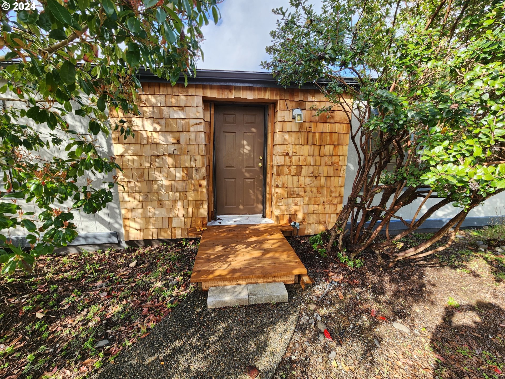 100 River Bend Road, Unit 127 Reedsport, OR 97467 - Photo 16 of 21 a view of entrance gate of the house