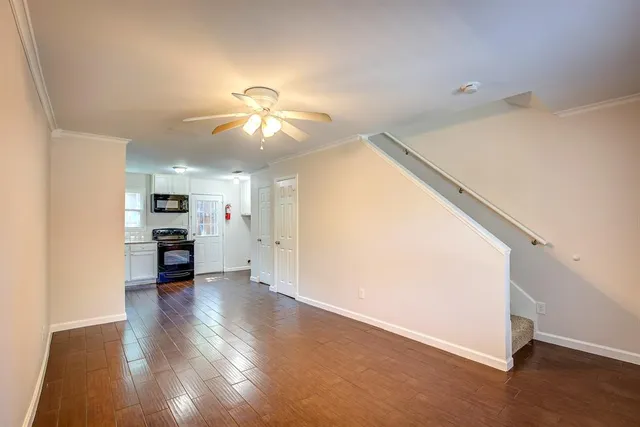 a view of a kitchen with a sink and a stove