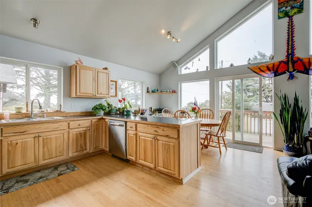 a kitchen with sink cabinets and dining table