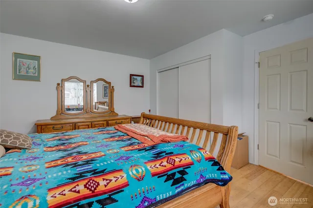 a bedroom with a bed and window