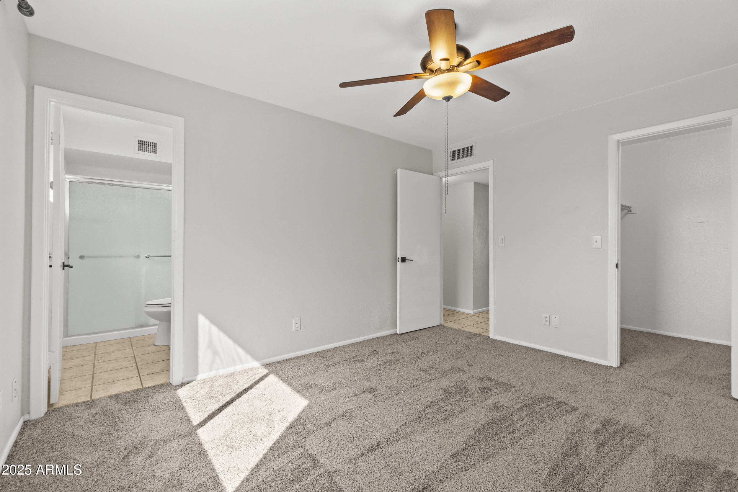 4119 West St John Road Glendale, AZ 85308 - Photo 16 of 29 a view of empty room with a ceiling fan