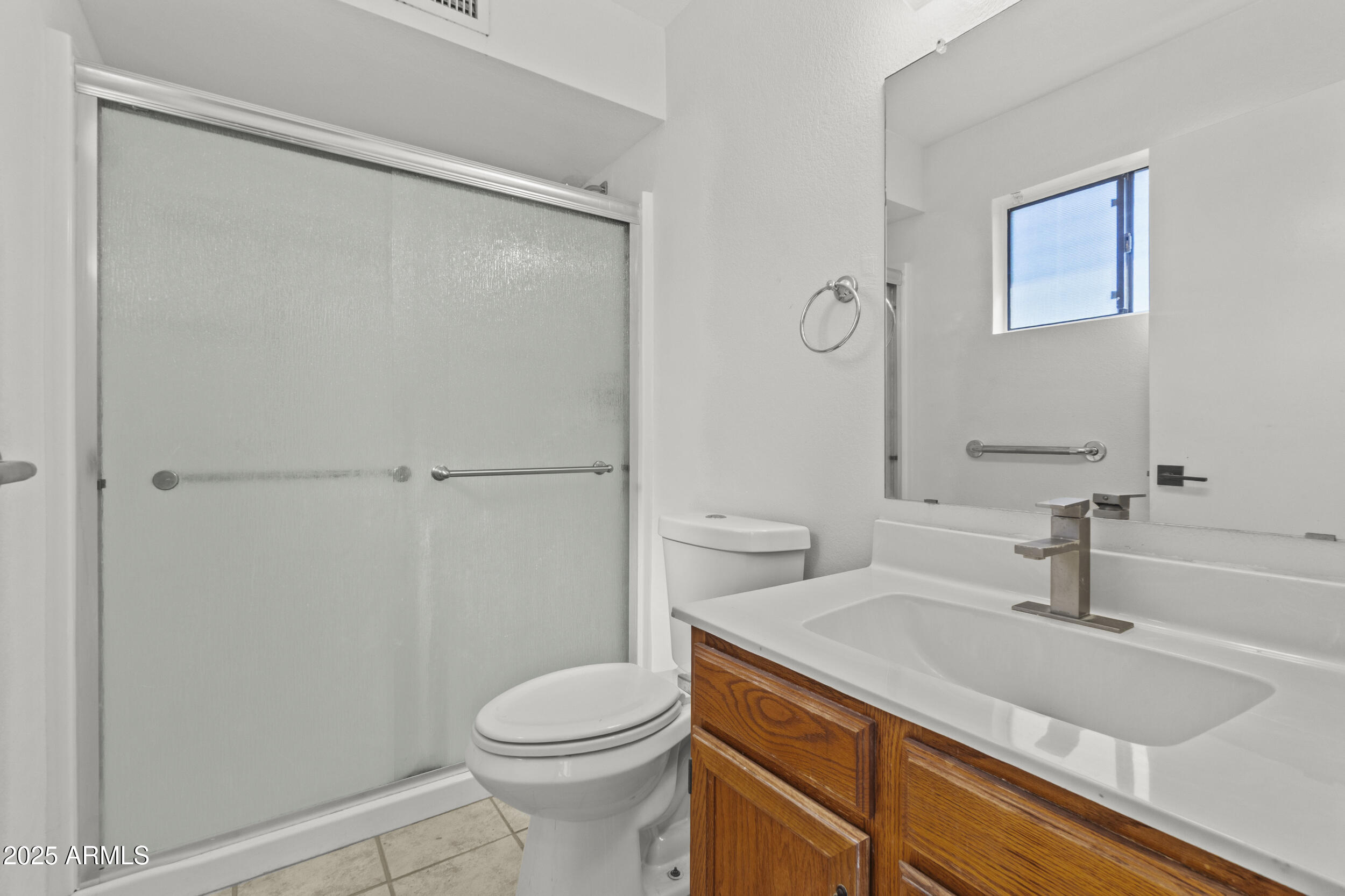 4119 West St John Road Glendale, AZ 85308 - Photo 17 of 29 a bathroom with a granite countertop sink toilet and shower