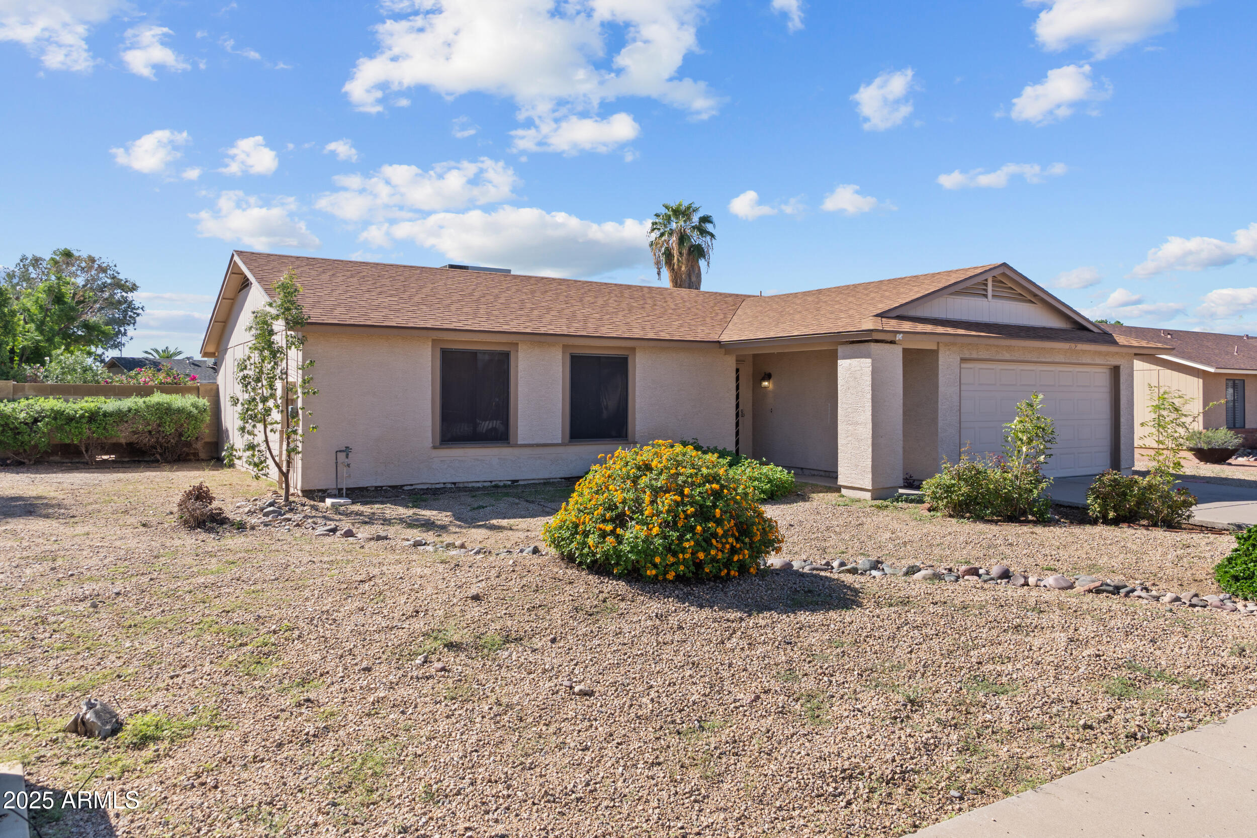 4119 West St John Road Glendale, AZ 85308 - Photo 2 of 29 a front view of a house with a yard