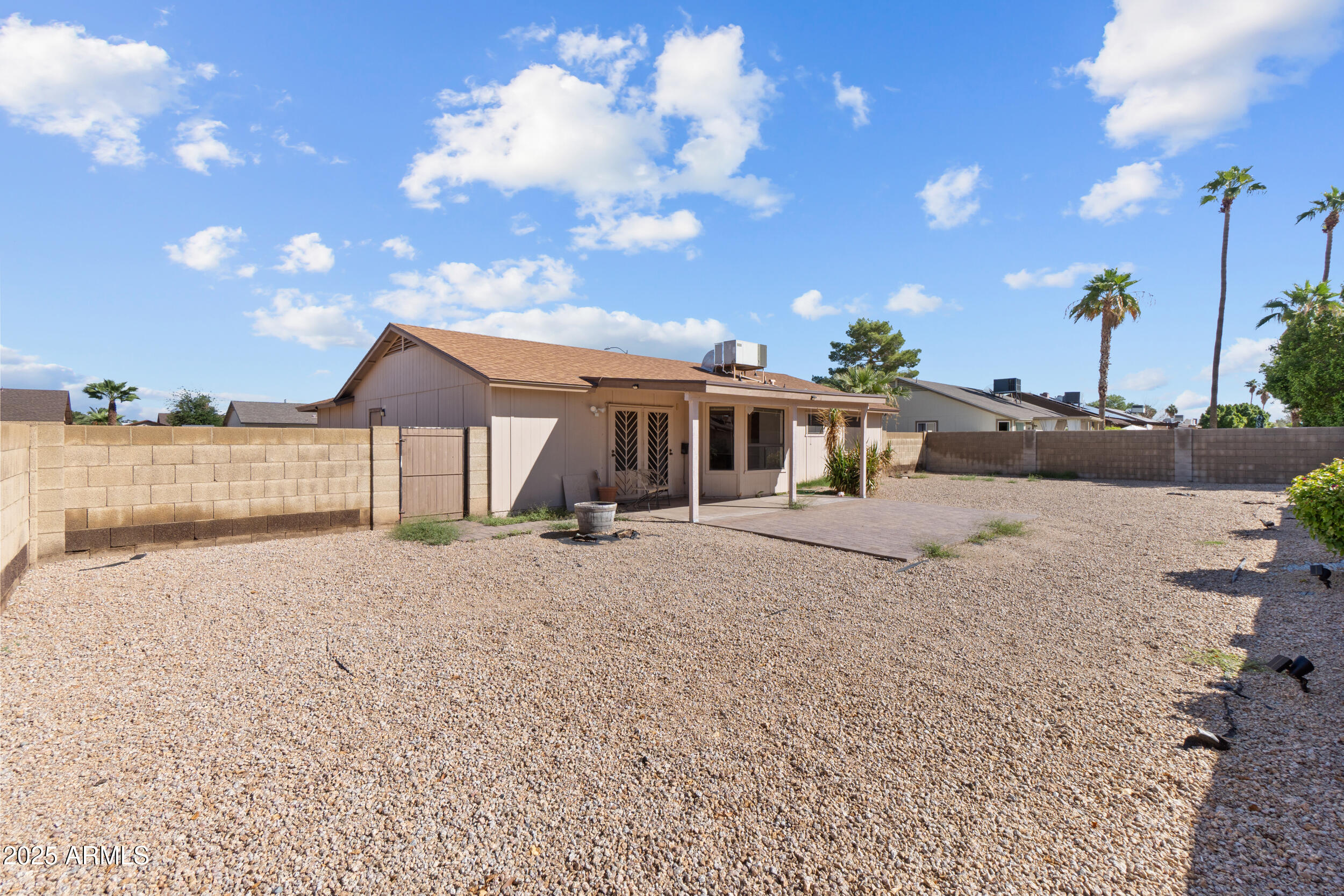 4119 West St John Road Glendale, AZ 85308 - Photo 26 of 29 a front view of a house with a yard and garage