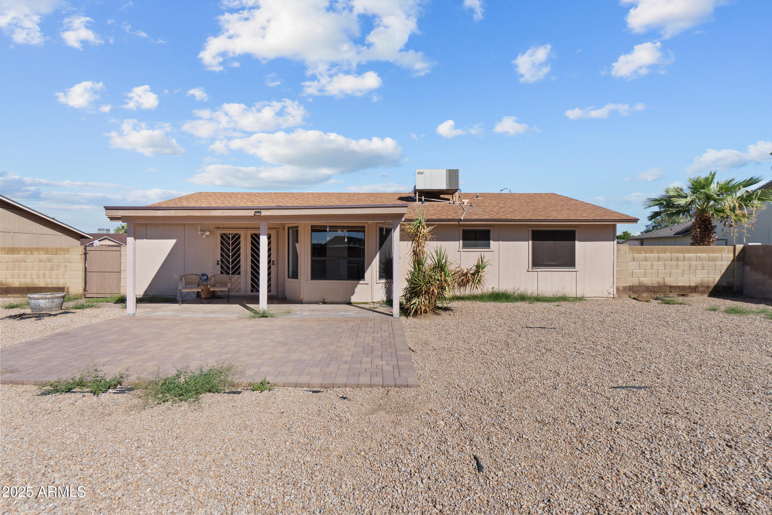 4119 West St John Road Glendale, AZ 85308 - Photo 29 of 29 a front view of a house with a yard and garage