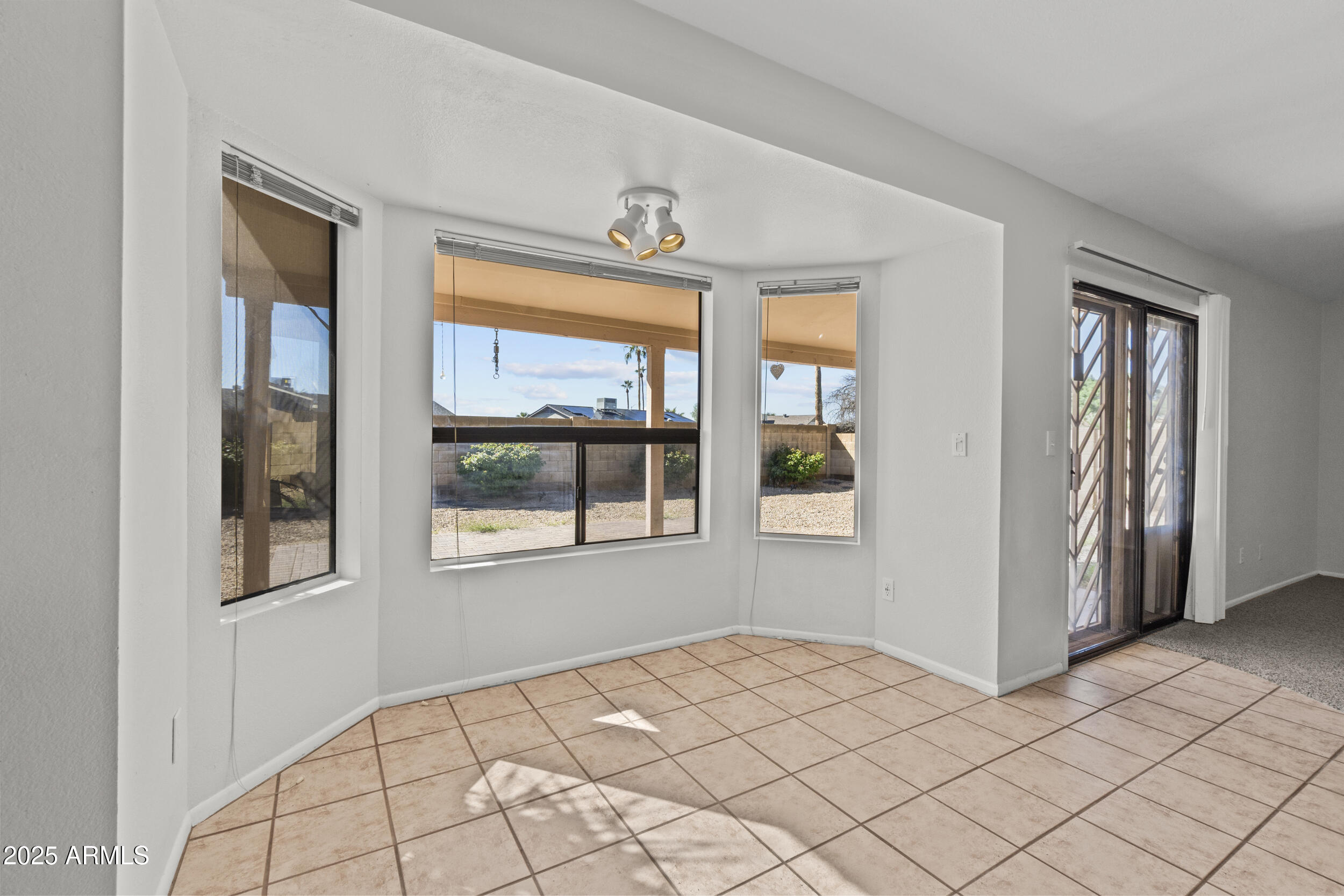 4119 West St John Road Glendale, AZ 85308 - Photo 7 of 29 a bedroom with a bed and a window