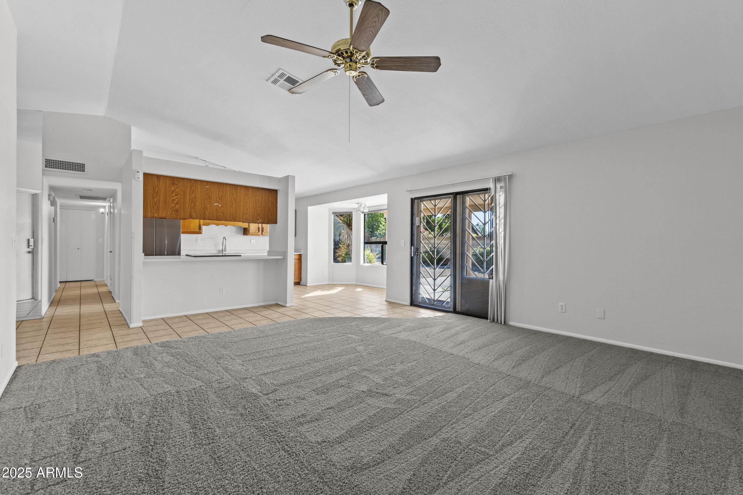 4119 West St John Road Glendale, AZ 85308 - Photo 9 of 29 a view of an empty room with a window