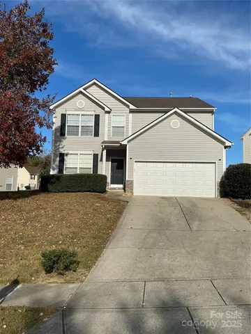 a view of front of house with a yard