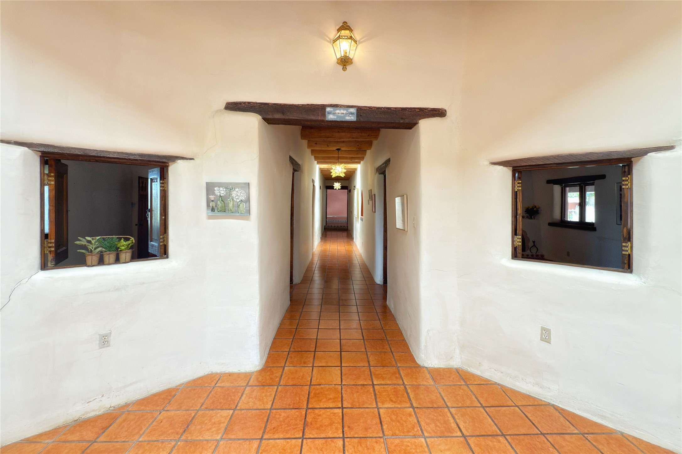 54 Rons Road Santa Fe, NM 87508 - Photo 27 of 99 Hallway from atrium to all bedrooms and outdoor access