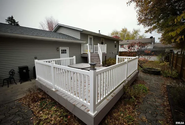a view of balcony with deck and outdoor seating