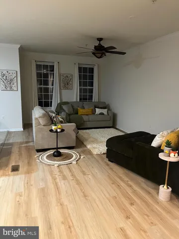 a kitchen with sink a refrigerator and cabinets