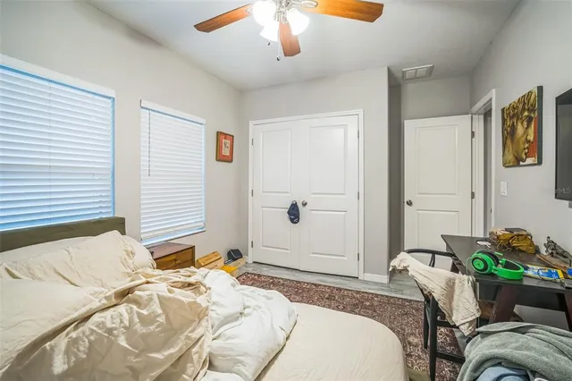 a bedroom with a bed and a cabinets