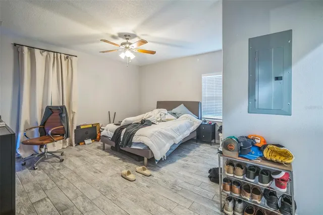 a bedroom with a bed and a television