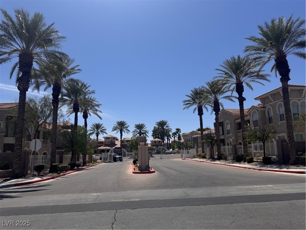 9975 Peace Way, Unit 1140 Las Vegas, NV 89147 - Photo 18 of 23 View of road featuring a residential view, sidewalks, and curbs