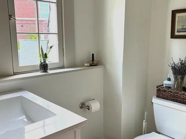 a bathroom with a sink and a window