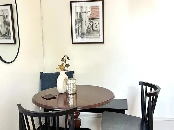 a view of a dining room with furniture and wooden floor