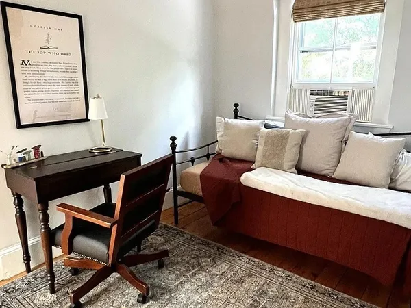 a living room with a couch and a window