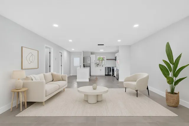 a view of kitchen and refrigerator