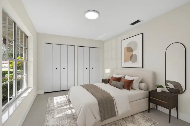 a view of a room with an empty space and a window