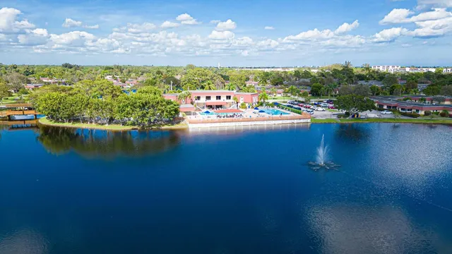 an aerial view of a house with a swimming pool