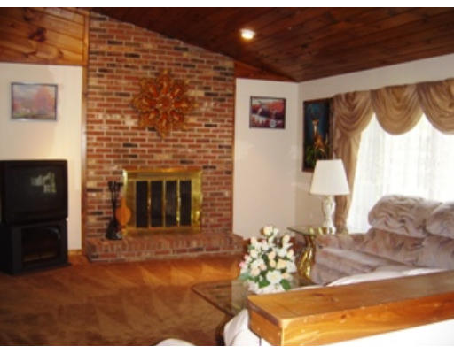 568 Burts Pit Road Northampton, MA 01062 - Photo 3 of 16 a view of a livingroom with furniture and a fireplace