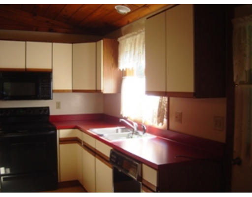 568 Burts Pit Road Northampton, MA 01062 - Photo 4 of 16 a kitchen with a sink cabinets and a microwave