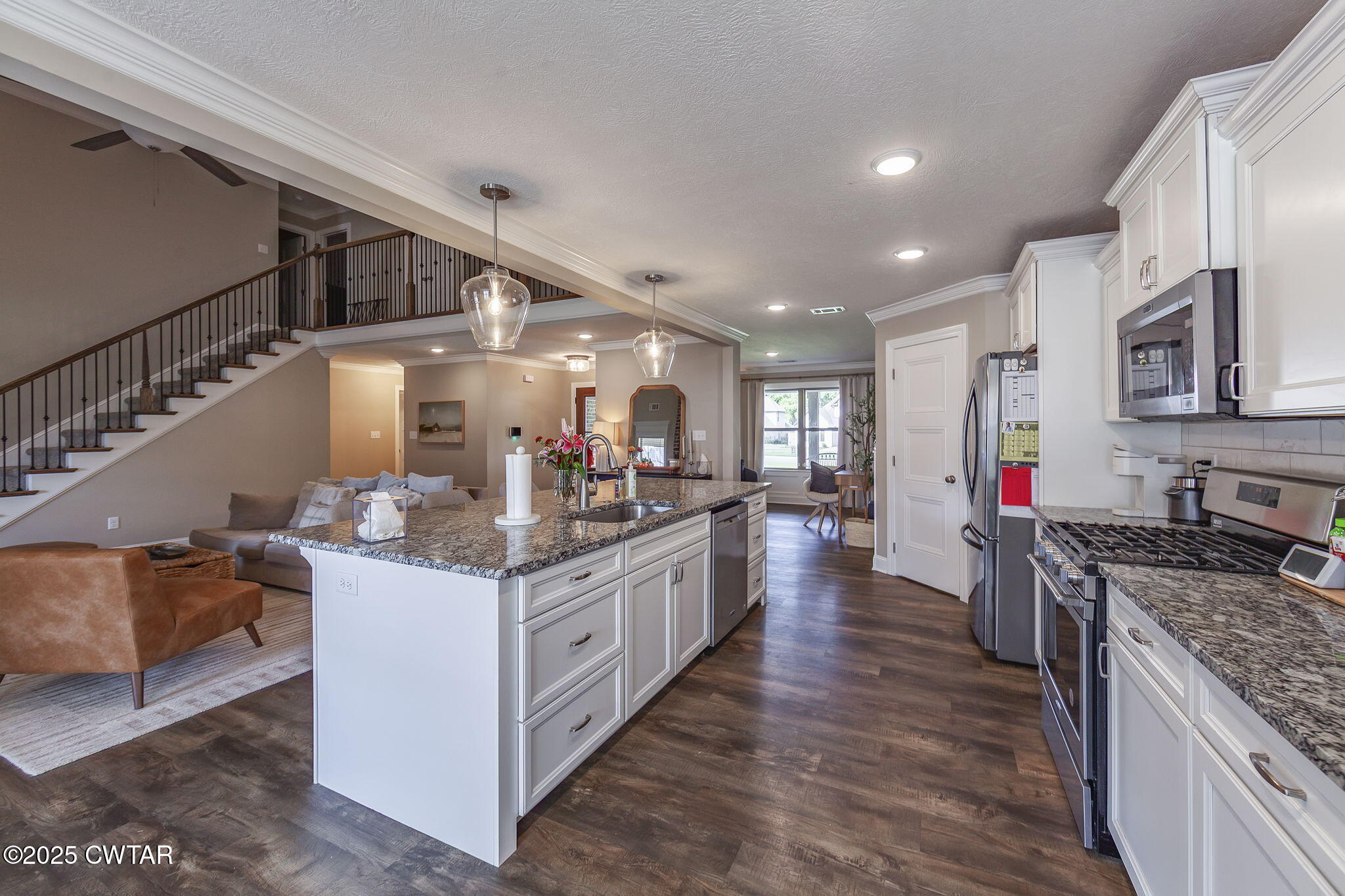105 Fawn Ridge Lane Medina, TN 38355 - Photo 12 of 40 a kitchen with stainless steel appliances granite countertop a stove and a sink