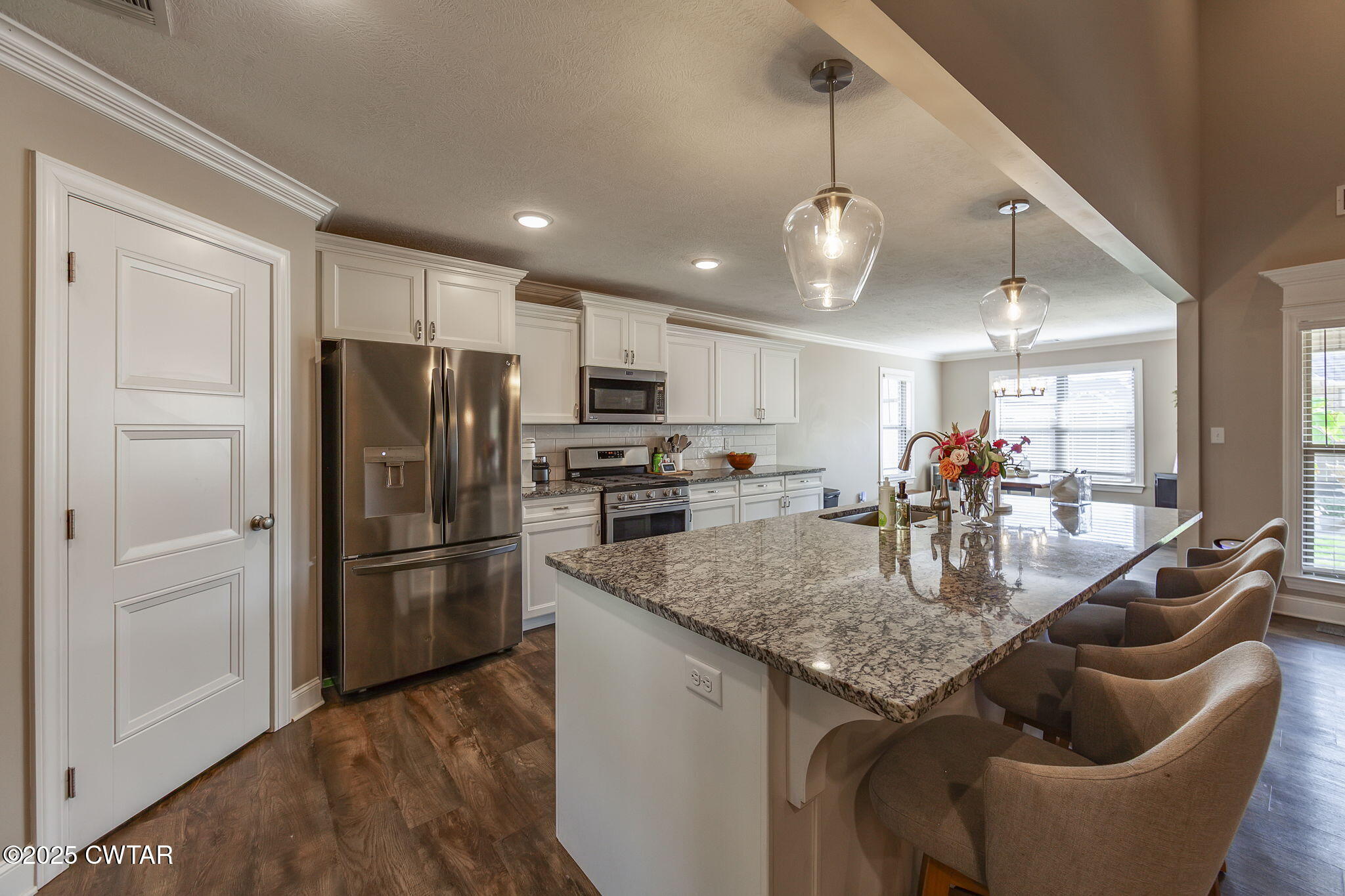 105 Fawn Ridge Lane Medina, TN 38355 - Photo 16 of 40 a kitchen with stainless steel appliances granite countertop a refrigerator a sink and a refrigerator