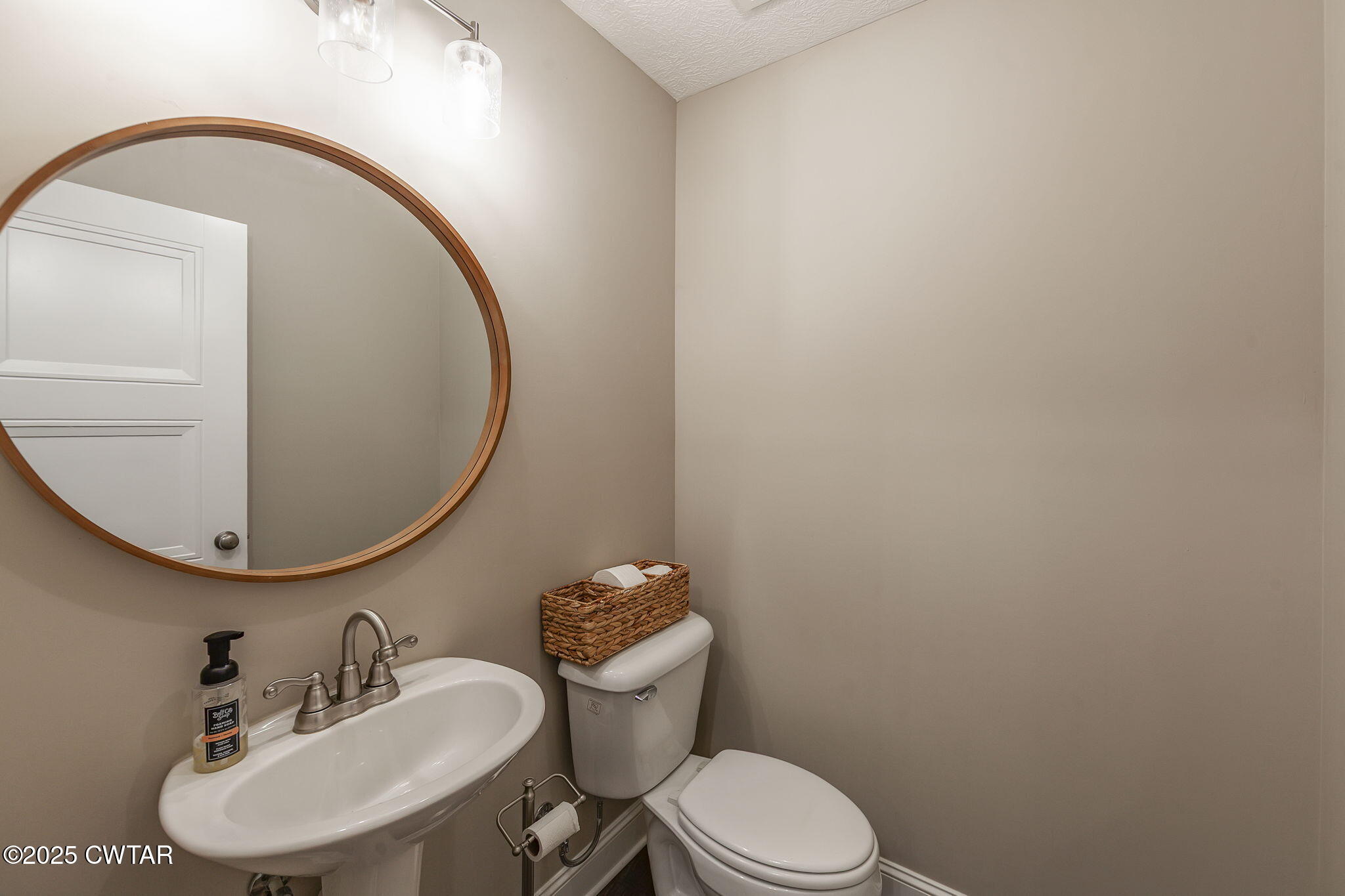 105 Fawn Ridge Lane Medina, TN 38355 - Photo 18 of 40 a bathroom with a toilet mirror and sink