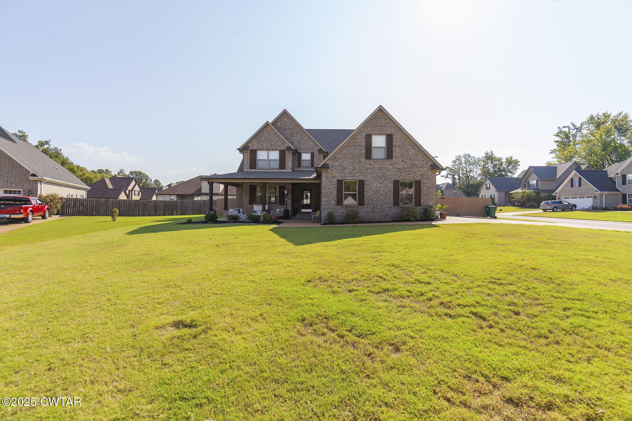 105 Fawn Ridge Lane Medina, TN 38355 - Photo 2 of 40 a view of a swimming pool with lawn chairs and large trees