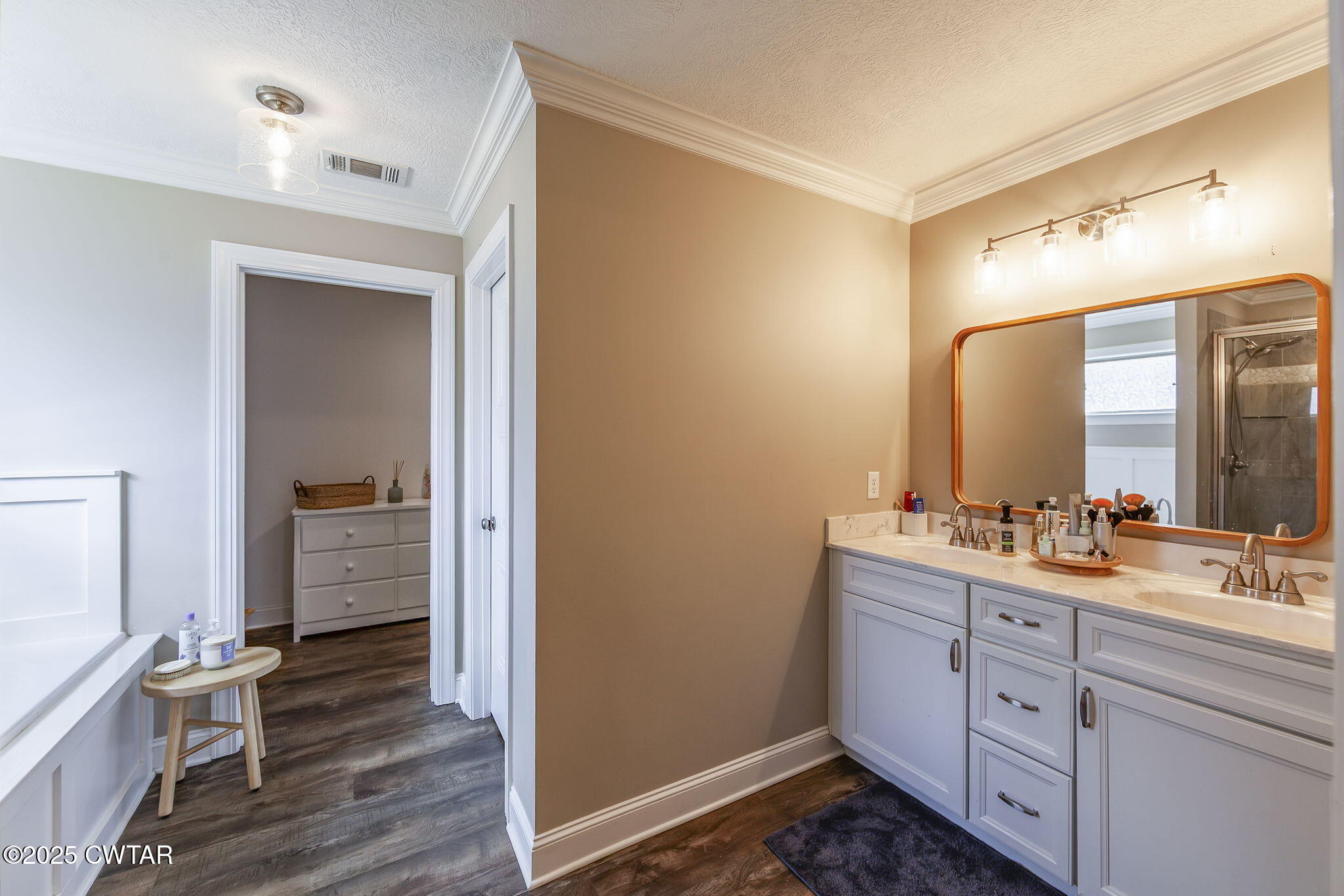 105 Fawn Ridge Lane Medina, TN 38355 - Photo 22 of 40 a bathroom with a double vanity sink a mirror and a shower