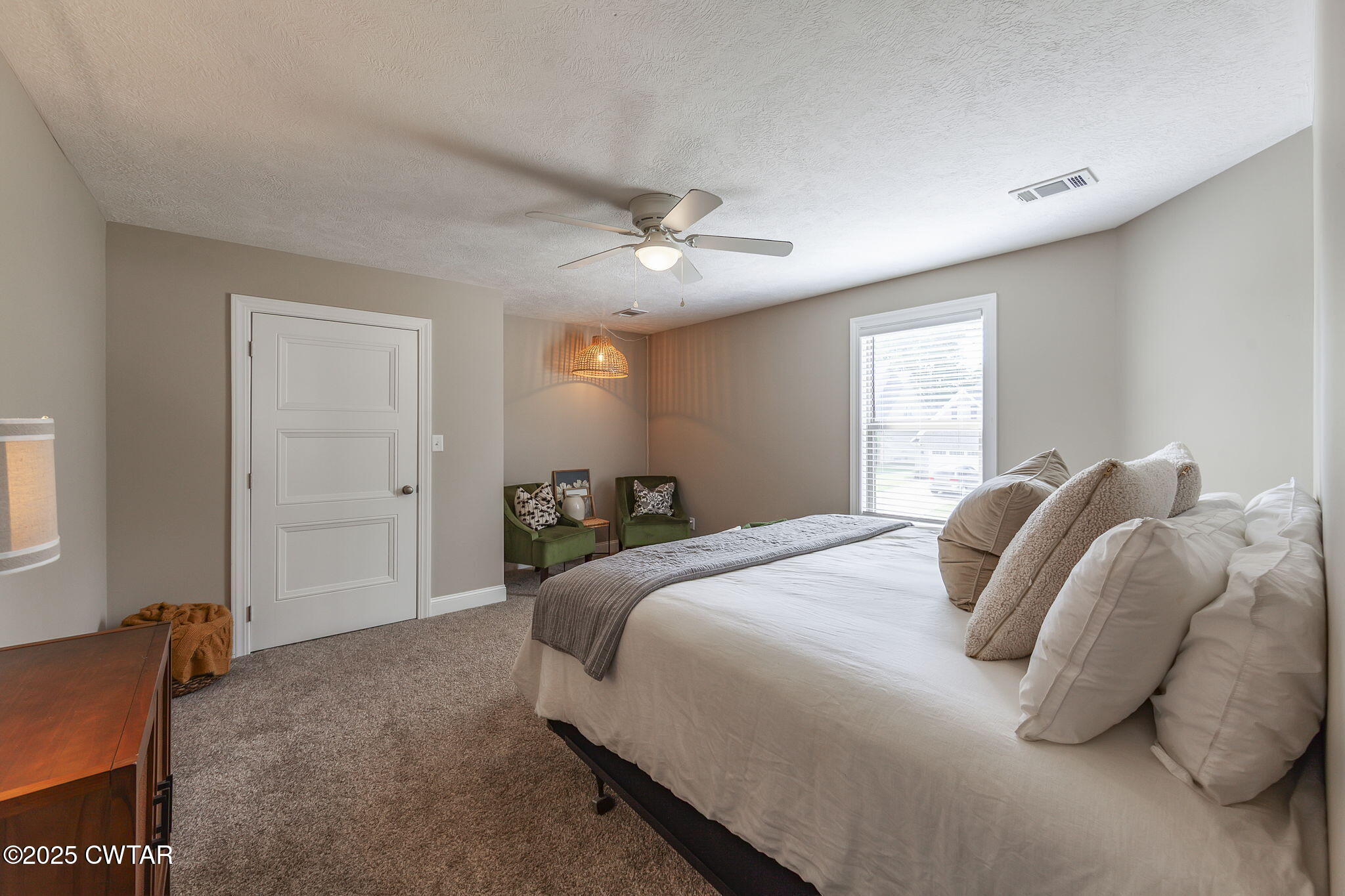 105 Fawn Ridge Lane Medina, TN 38355 - Photo 27 of 40 a bedroom with a bed and a chandelier