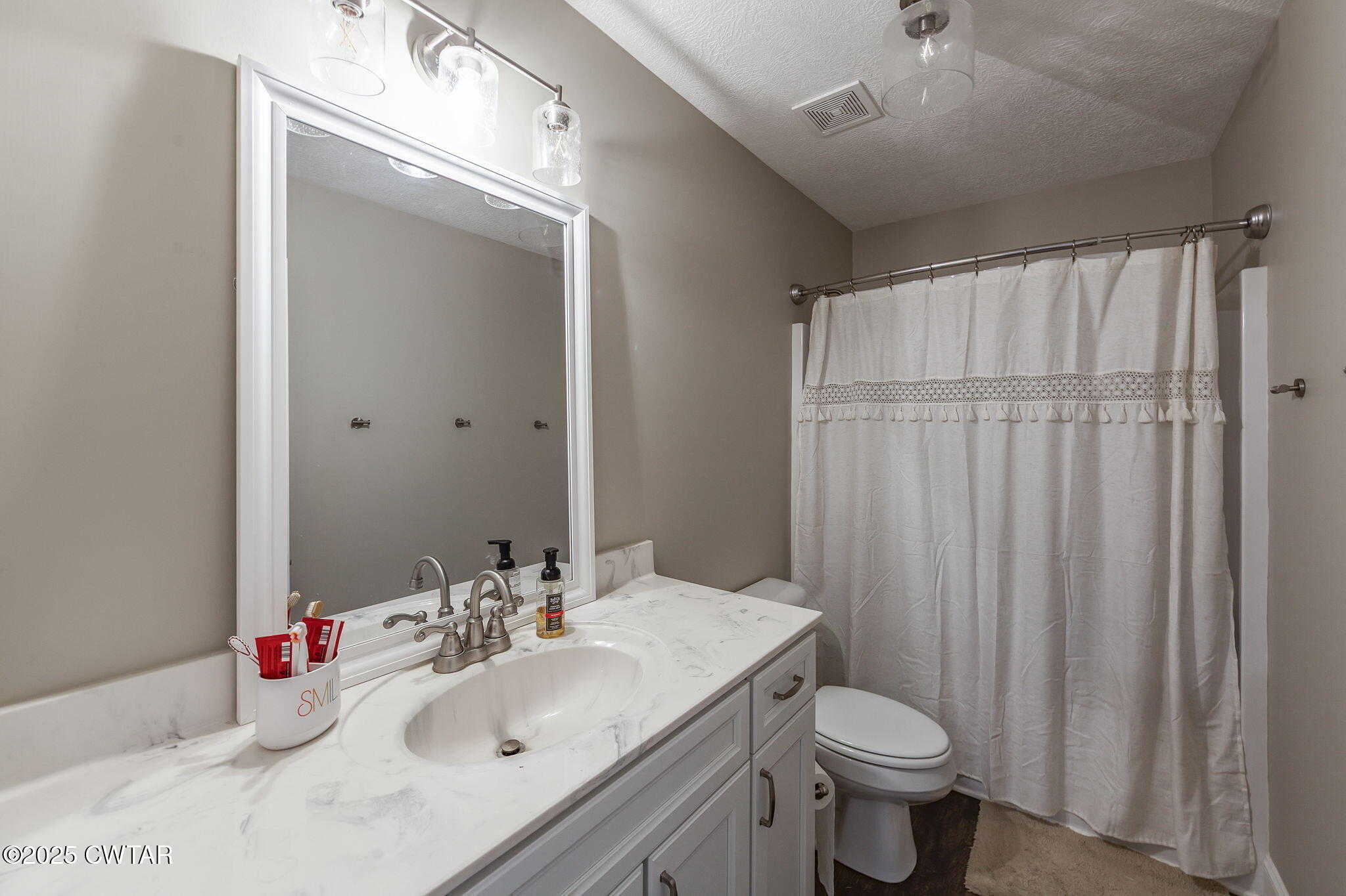 105 Fawn Ridge Lane Medina, TN 38355 - Photo 29 of 40 a bathroom with a sink toilet and shower