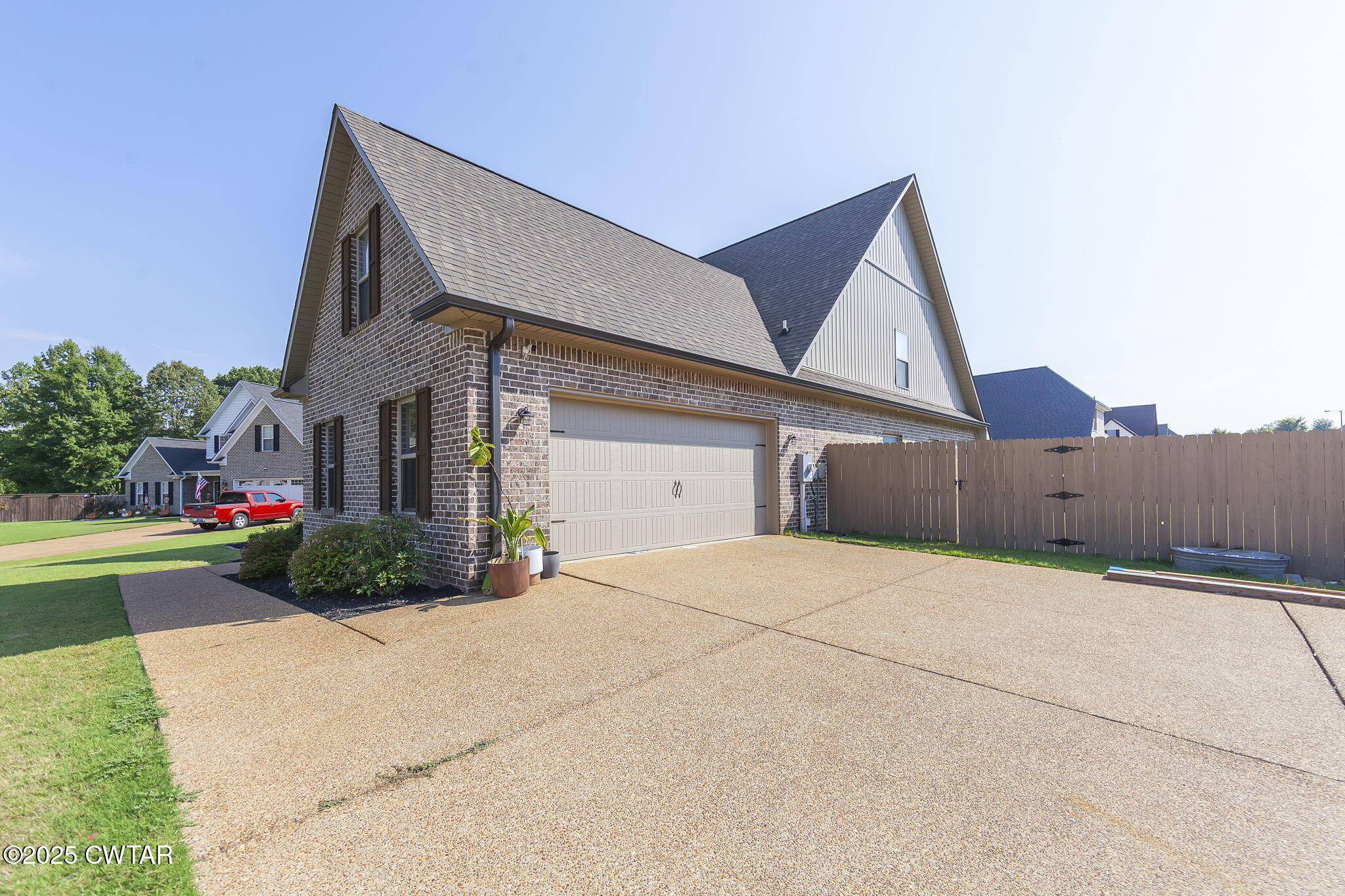 105 Fawn Ridge Lane Medina, TN 38355 - Photo 3 of 40 a front view of a house with a yard and garage