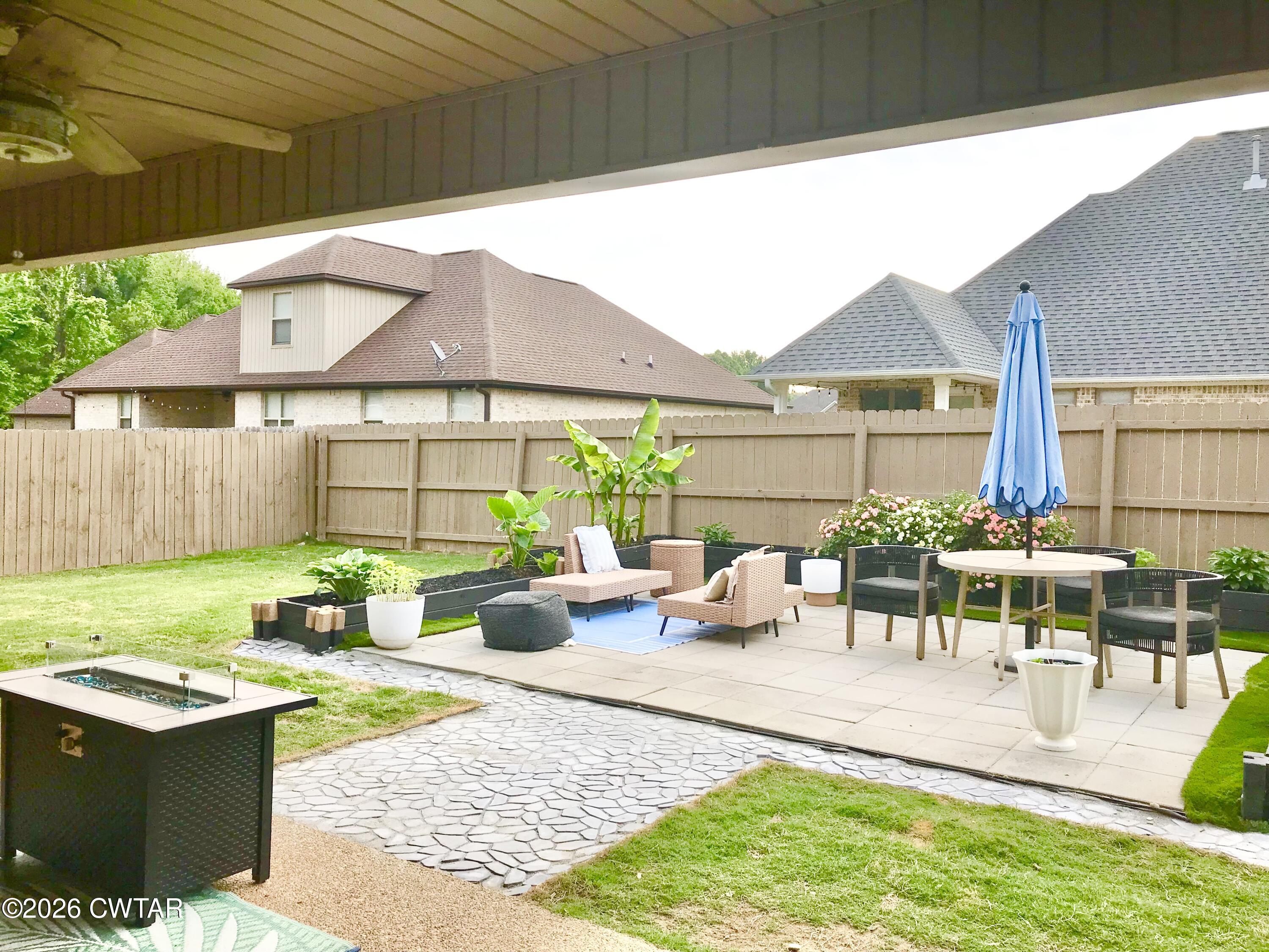 105 Fawn Ridge Lane Medina, TN 38355 - Photo 33 of 40 a view of a patio with couches table and chairs and potted plants