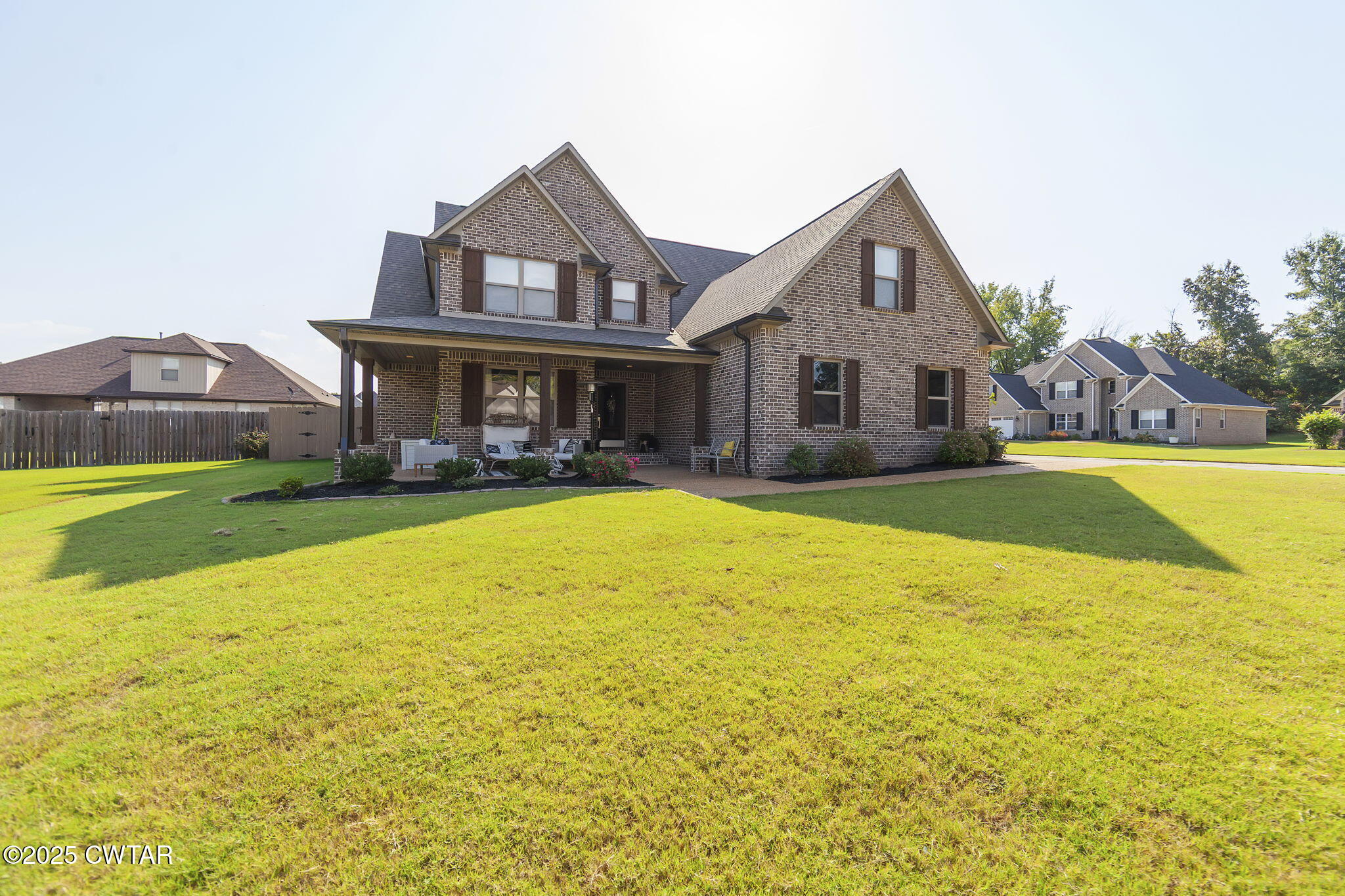 105 Fawn Ridge Lane Medina, TN 38355 - Photo 39 of 40 a front view of house with yard and swimming pool