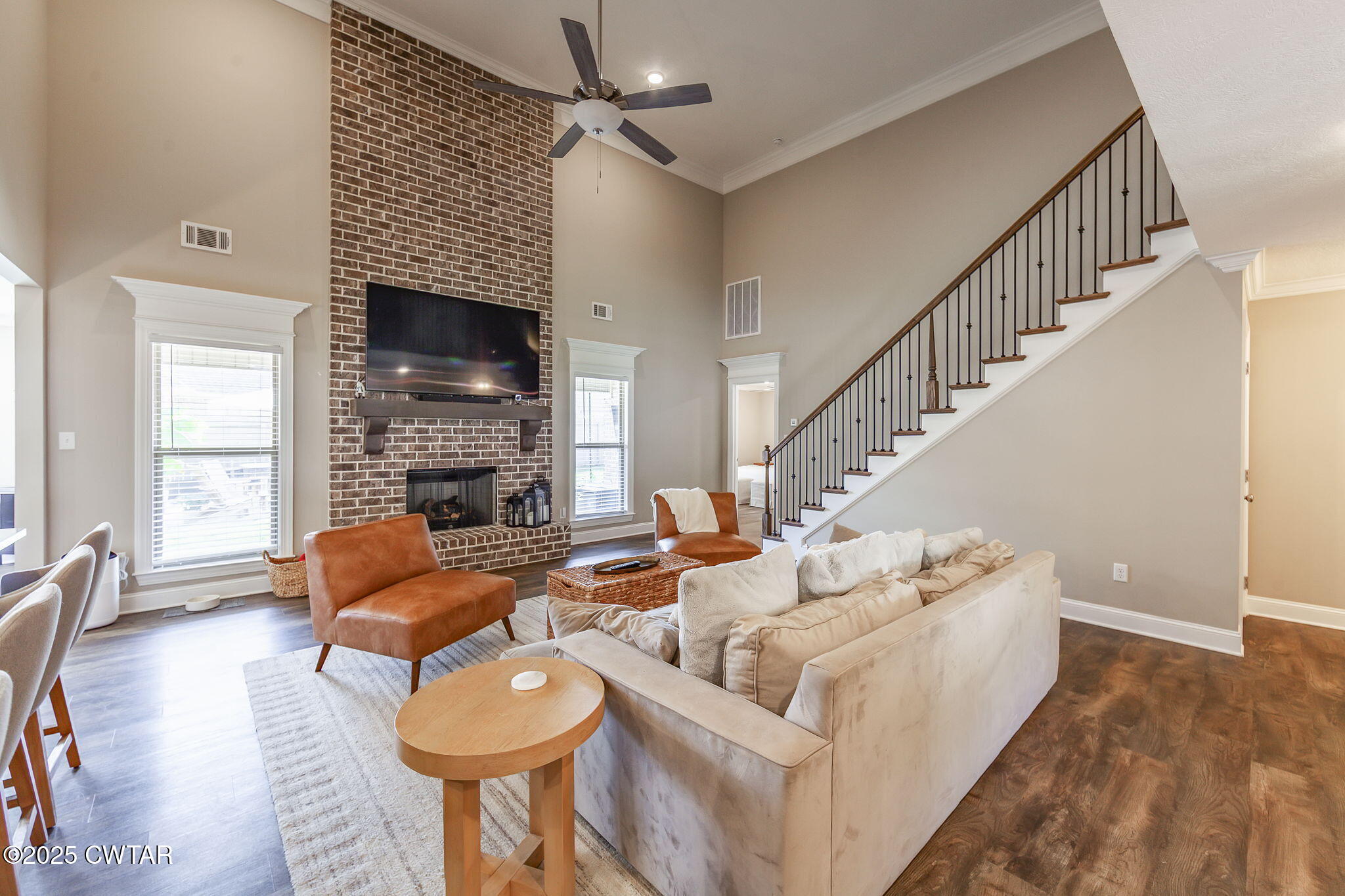 105 Fawn Ridge Lane Medina, TN 38355 - Photo 4 of 40 a living room with furniture a fireplace and a flat screen tv