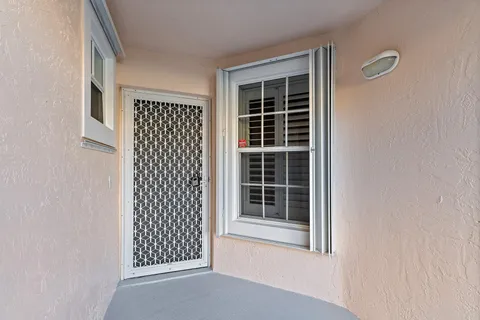 a view of front door with wooden floor