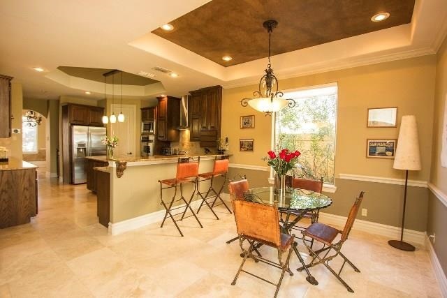 310 Lake Powell Laredo, TX 78041 - Photo 4 of 9 a view of a dining room with furniture and a chandelier