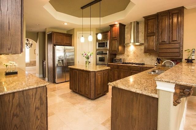 310 Lake Powell Laredo, TX 78041 - Photo 5 of 9 a kitchen with a sink a counter top space and stainless steel appliances