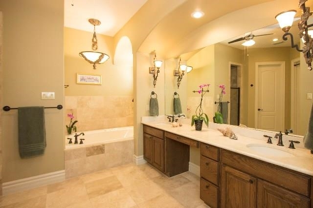 310 Lake Powell Laredo, TX 78041 - Photo 6 of 9 a bathroom with a double vanity sink mirror and shower