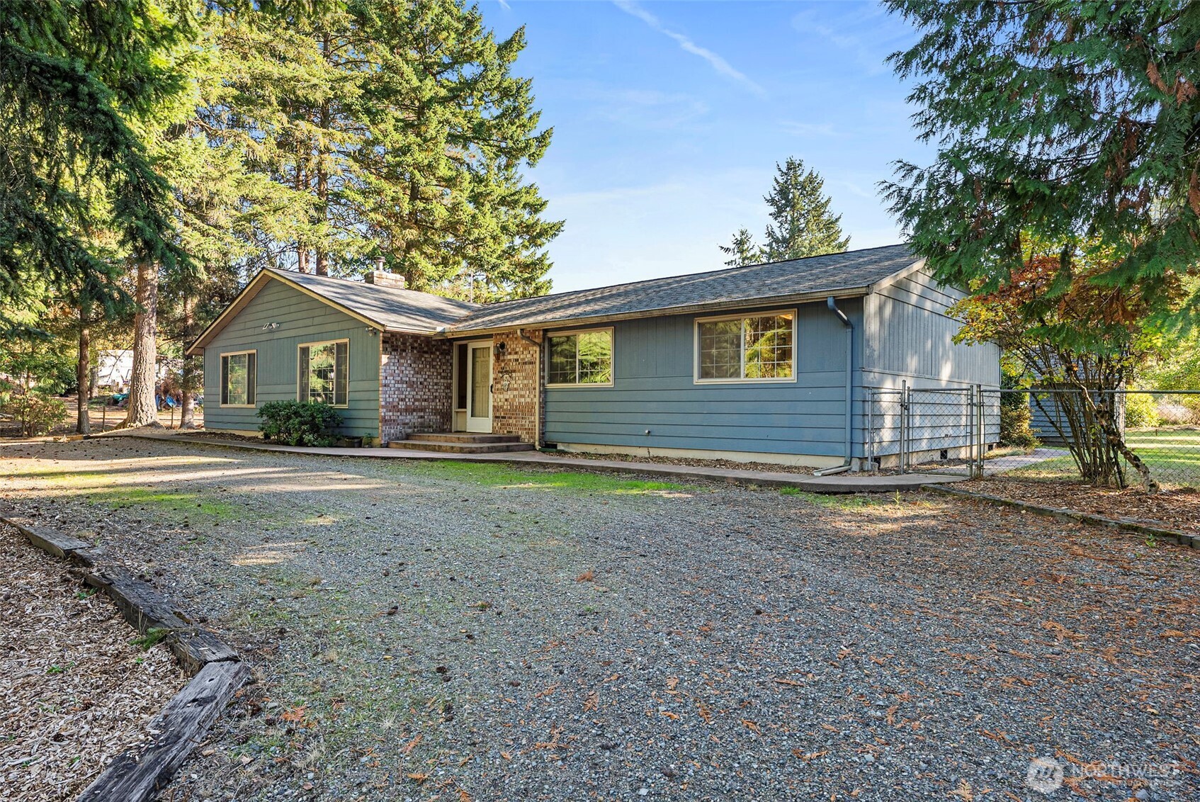 8112 266th Street East Graham, WA 98338 - Photo 2 of 40 a house view with a garden space