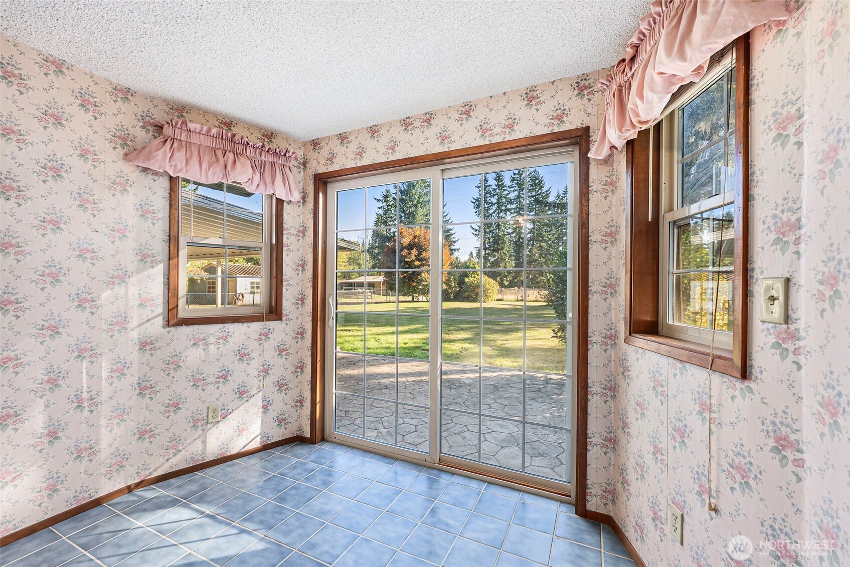 8112 266th Street East Graham, WA 98338 - Photo 23 of 40 a view of a room that has a large window and front door